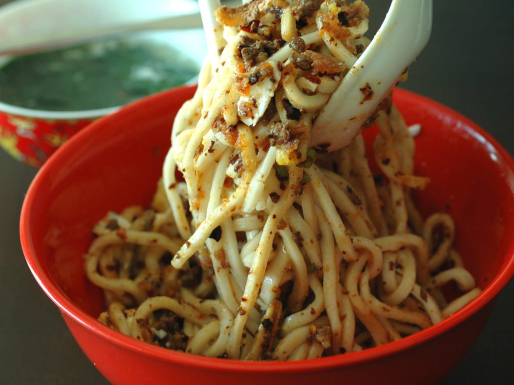 mixing pork spicy noodles